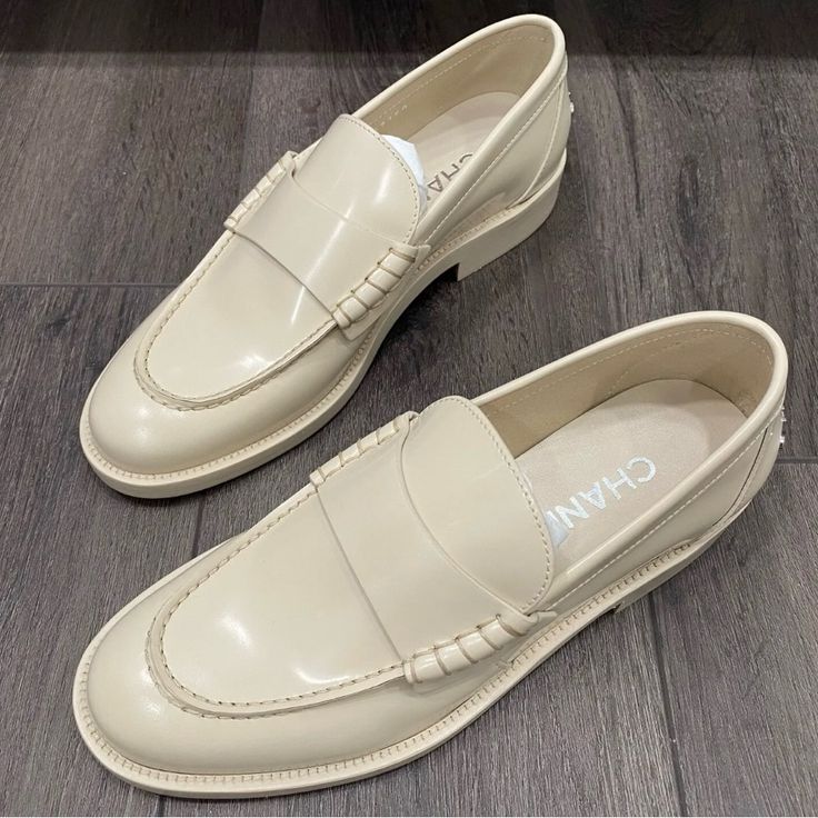 Chanel Ivory Shiny Leather Loafers Oxford Shoes Ivory Leather Gold Tone Chanel Logo On The Back Round Toe Made In Italy Please Note This Item Comes Without Box Classic Cream Slip-on Moccasins, Elegant Beige Leather Shoes With Rubber Sole, Formal Cream Slip-on Flats, Classic Cream Leather Shoes With Leather Sole, Beige Slip-on Leather Shoes For Business, Cream Slip-on Flats For Office, Elegant Beige Leather Moccasins, Cream Round Toe Slip-on Loafers, Luxury Beige Leather Shoes With Almond Toe