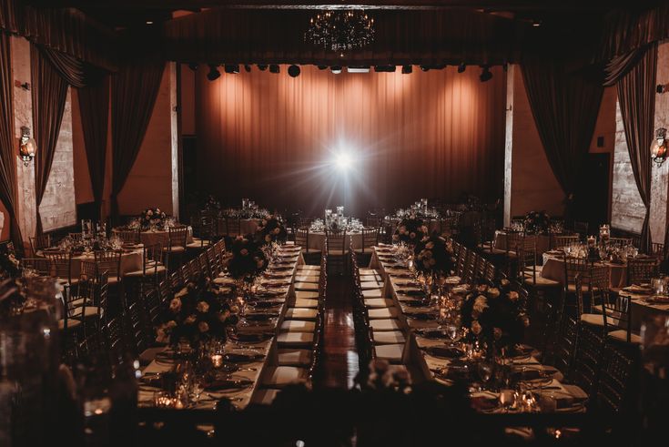 an empty banquet hall with tables and chairs