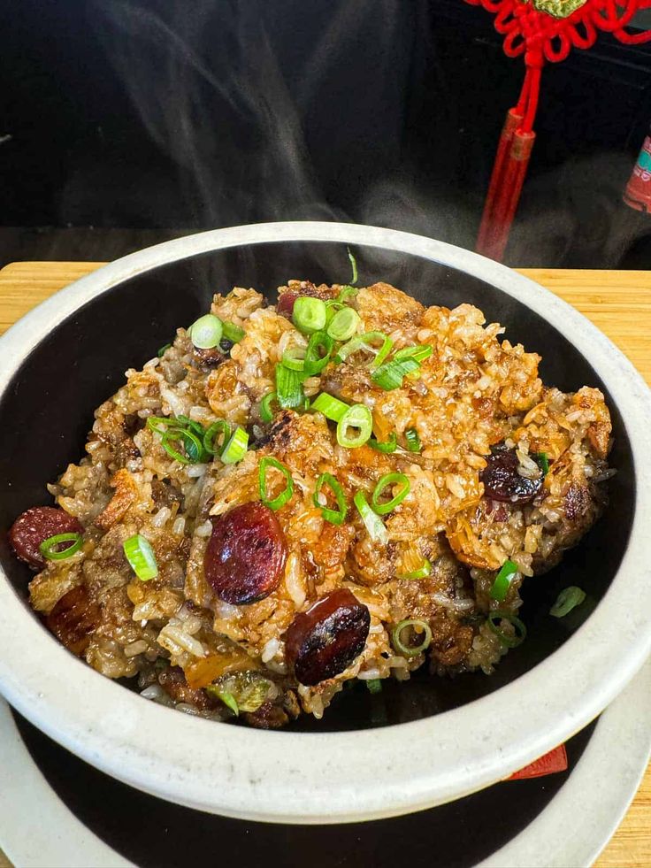 a bowl filled with food sitting on top of a table