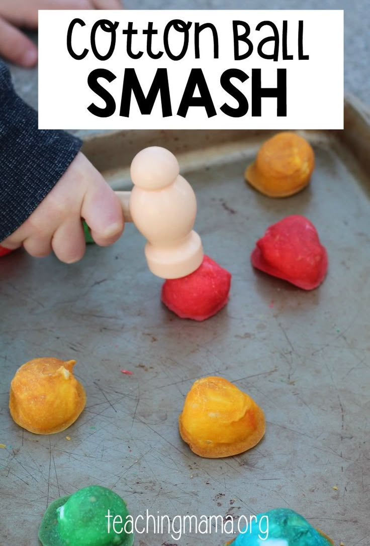 this is an image of cotton ball smash for toddlers to play in the sand