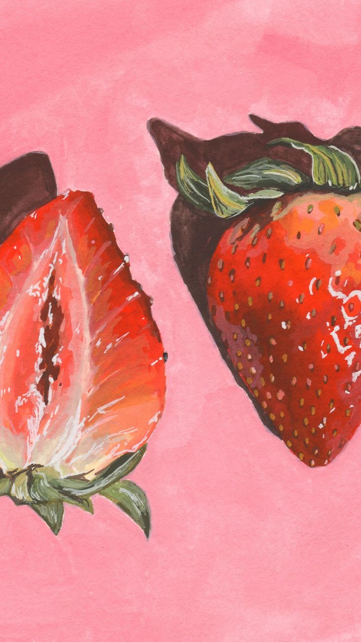 two strawberries on a pink background, one is cut in half