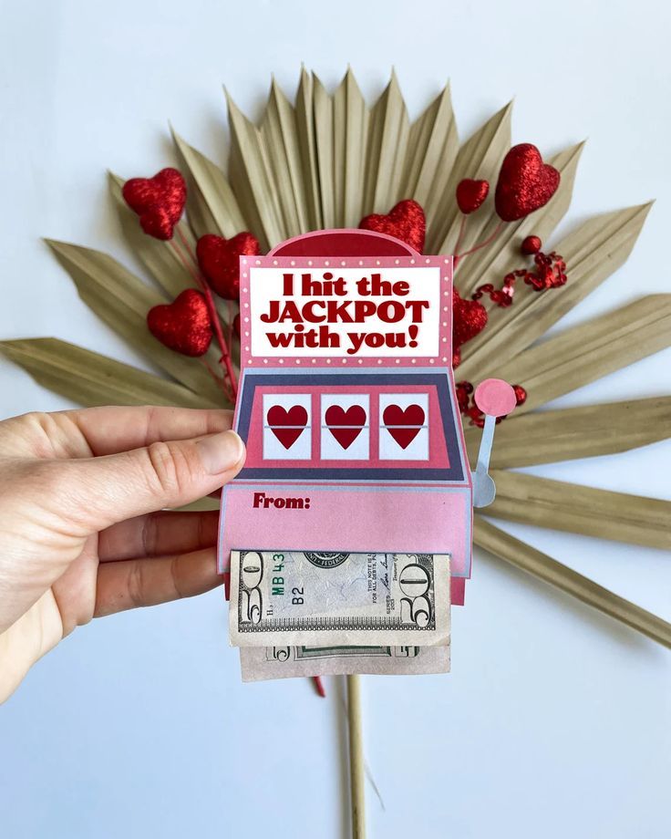 someone is holding up a valentine's card that says i hit the jackpot with you