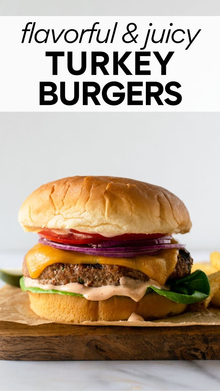 a close up of a burger on a cutting board with the words, flavorful and juicy turkey burgers