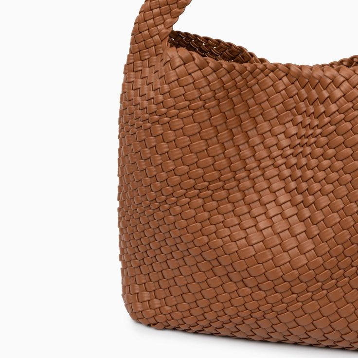 The leather-woven exterior of this bucket bag adds a touch of sophistication to every ensemble. Beyond its stylish facade, this bag boasts an extra-large capacity, ensuring you can carry everything from daily essentials to those extra must-haves. Crafted from premium vegan & cruelty-free leather, the lightweight construction adds to the bag's appeal, allowing you to carry everything you need without compromising comfort. Now available in black, caramel, olive green, and white. Vegan Leather Handbag, Hobo Shoulder Bag, Bangle Ring, Daily Essentials, Love Ring, Bag Set, Necklace Earring Set, White Bag, Clutch Handbag