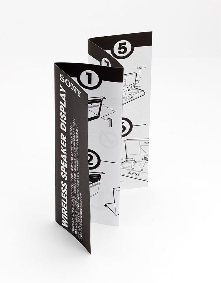 two folded brochures with black and white designs on the front one has an arrow