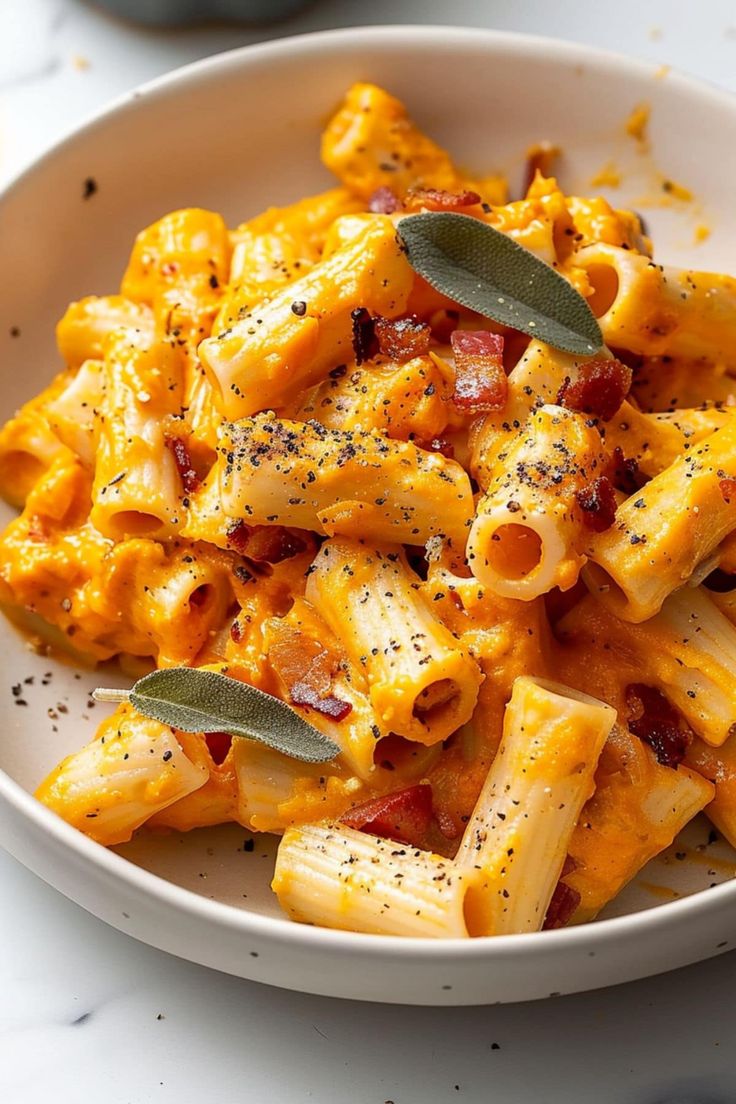 a white bowl filled with macaroni and cheese