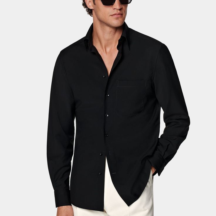 This black shirt is tailored to a casual tailored fit and features a large point collar, French placket, and single cuffs. Black Cotton Shirt With Concealed Placket, Black Office Shirt With Concealed Placket, Classic Black Shirt With Hidden Button Closure, Classic Black Button-up Shirt, Black Shirt With Welt Pockets For Work, Classic Black Single Breasted Top, Classic Black Single-breasted Top, Black Business Shirt With Concealed Placket, Black Slim Fit Shirt For Formal Occasions