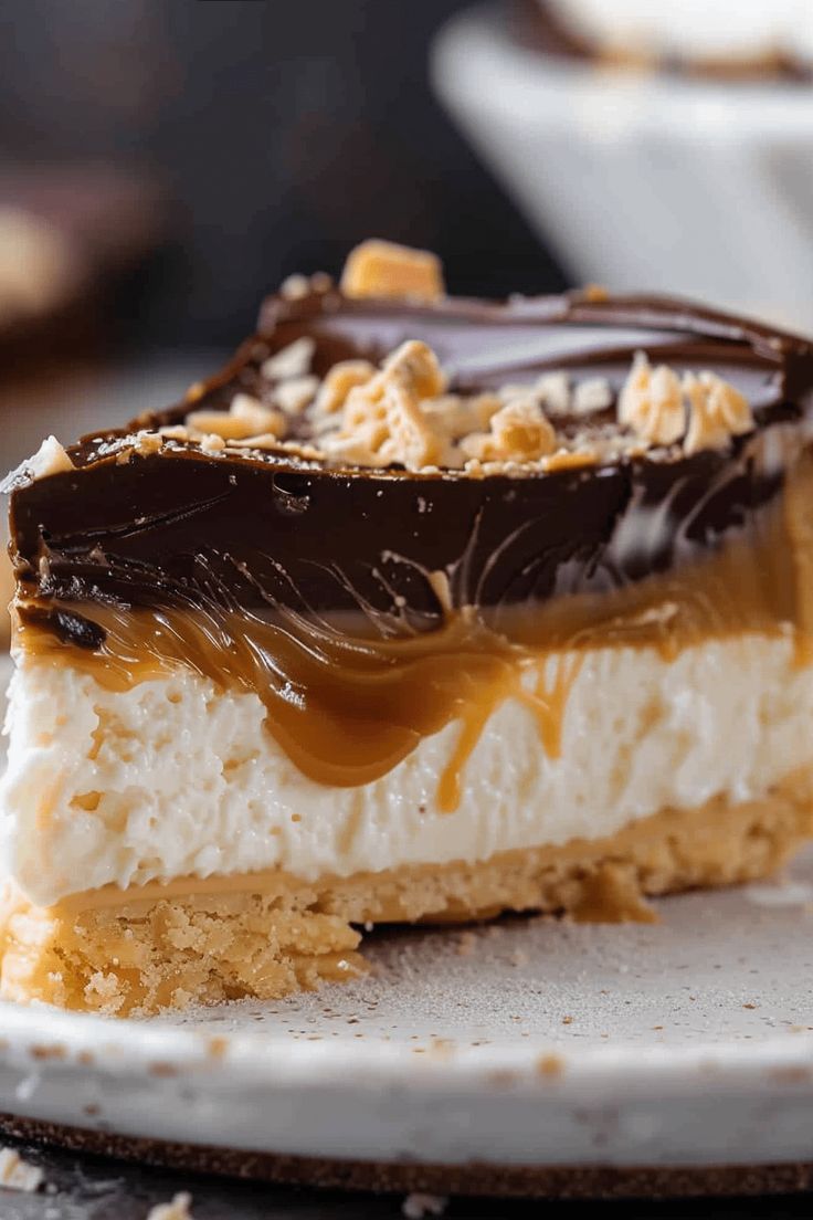 a piece of cake on a plate with chocolate and marshmallows in the middle