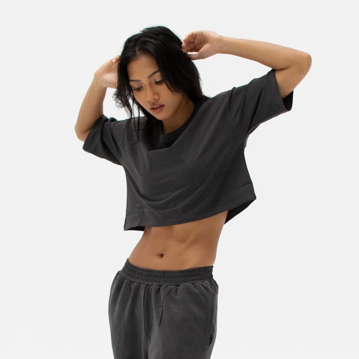 The Easy Crop Top is a must-have essential in your wardrobe. You will love our lightweight organic cotton crop top, which is perfect for your everyday basics. This piece is such a staple throw on our matching comfy sweats for a flawless street look or pair it with your favourite leggings or jeans. Ideal for in the gym and out on the streets. Made from our lightweight organic cotton. 95% organic cotton, 5% Elastane. Dyed with certified Eco-Friendly dyes. GOTS & OEKO-TEX® approved. All packaging is recycled or responsibly sourced. Cotton Athleisure Cropped T-shirt For Workout, Casual Cotton Crop Top Activewear, Versatile Cotton T-shirt For Loungewear, Versatile Soft-washed Cotton Top, Athleisure Crop Top T-shirt For Loungewear, Relaxed Cotton Activewear For Relaxation, Spring Cotton Crop Top Activewear, Boxy Fit Cropped Cotton Top, Casual Cotton Crop Top For Workout