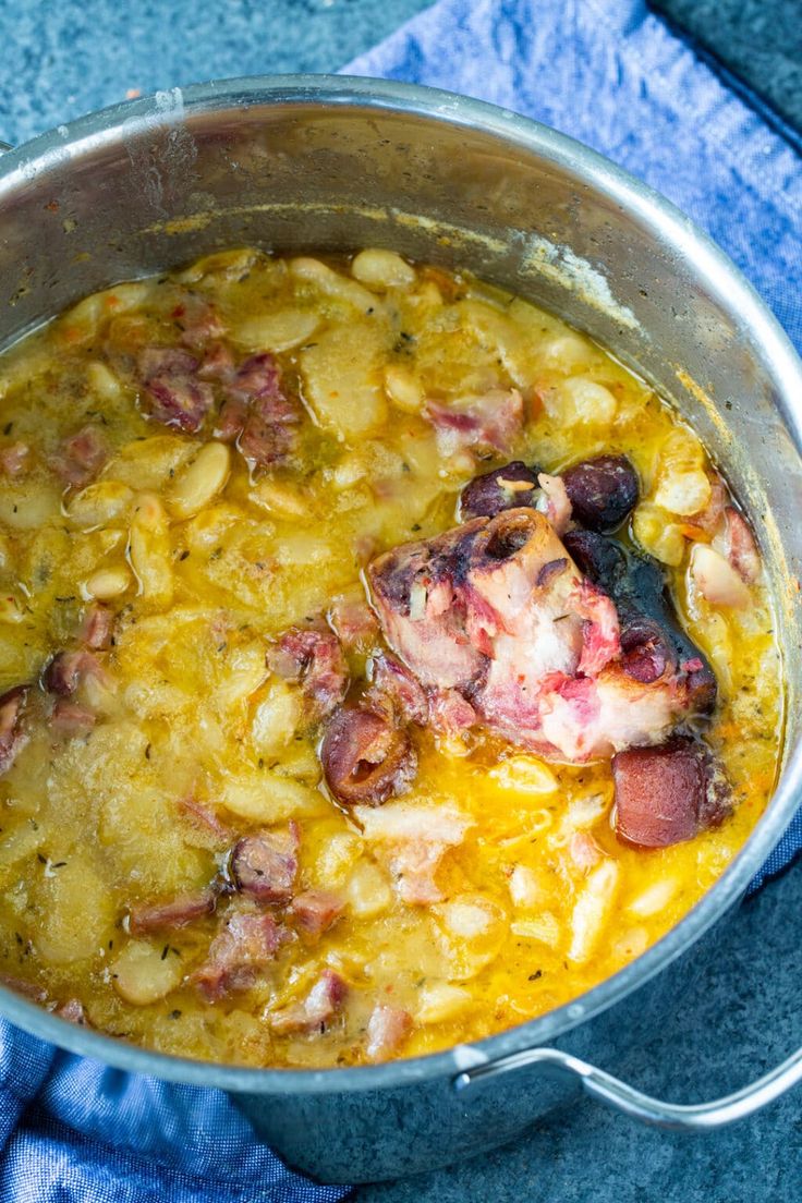 a pot filled with food sitting on top of a blue towel