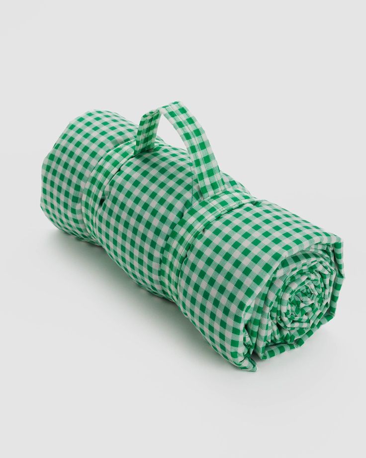 a green and white checkered blanket folded up