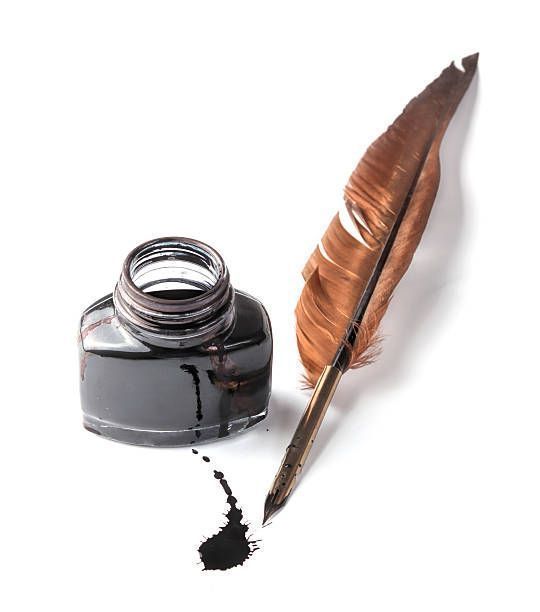 a feather quill and ink bottle on a white background with a black ink pen