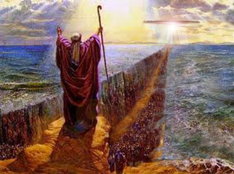 an image of jesus standing on the edge of a cliff with his arms in the air