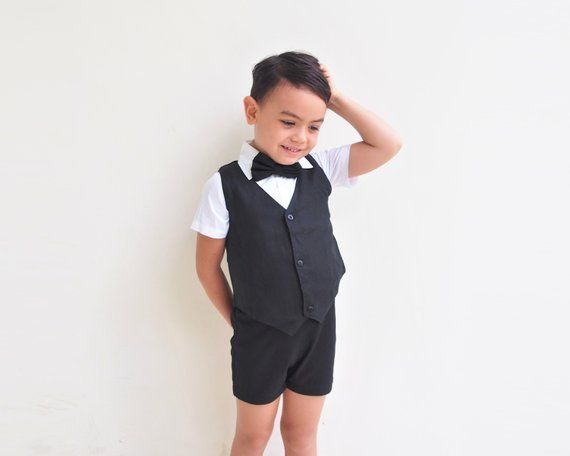 This adorable 4 pcs. black Christening Outfit/ Page boy outfit / wedding outfit contains of the following: - Suspender Shorts- White dress Oxford Shirt- Vest- Bow TieSuspender Shorts have a flat front waistband with elastic back and fully removable suspender straps that attach with buttons in the front and back. The Bow Tie comes with a 5cm (approx. 2") Velcro closure to make it an adjustable strap.Great for baby's first birthday, photo shoot, family gathering, as a Christening outfit, Page boy Black Summer Formal Set, Boy Ring, Boy Christening Outfit, Suspender Shorts, Suspenders For Boys, Bearer Outfit, Black Suspenders, Baptism Outfit, Bowtie And Suspenders