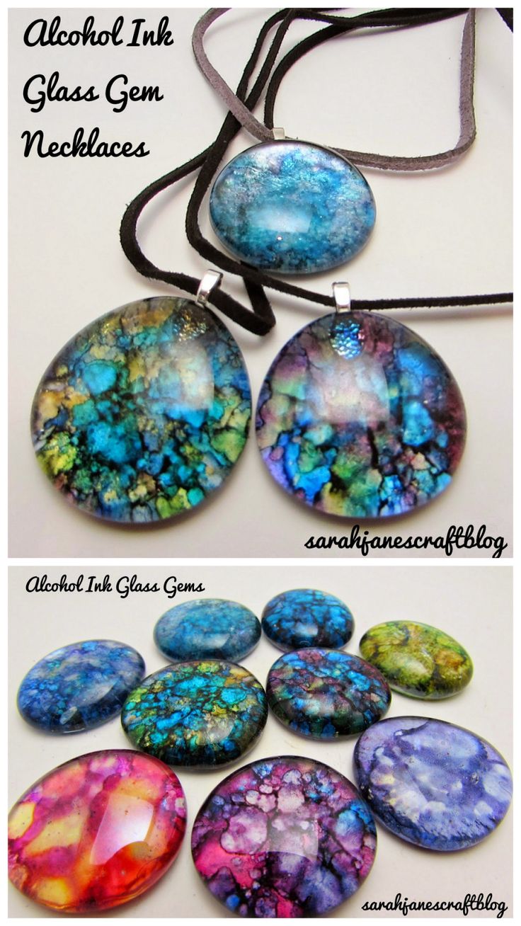 four different types of glass pendants on a black cord with the words alcohol ink class gems necklaces