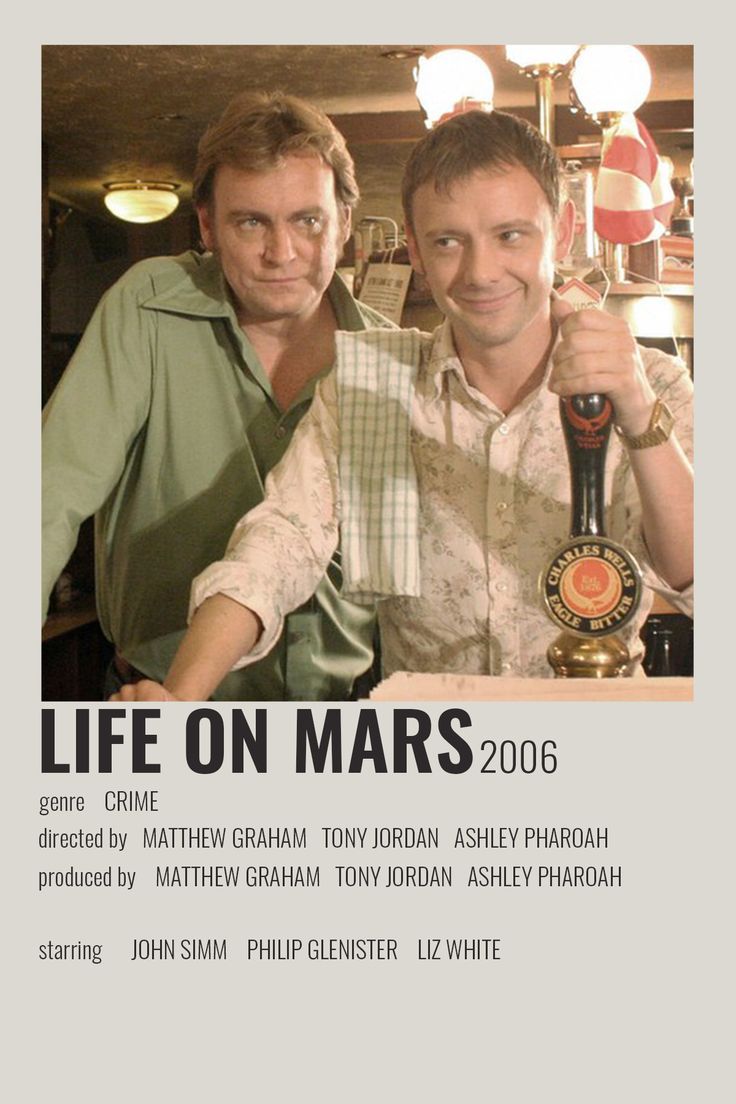 two men standing next to each other in front of a sign that says life on mars 2006