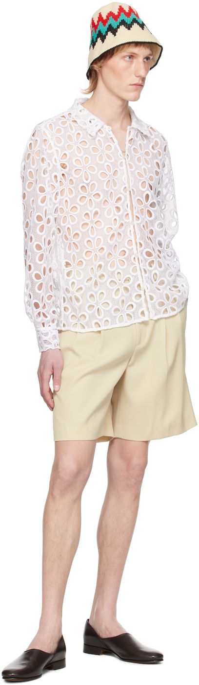 Sheer cotton lace shirt. Cutouts and floral pattern embroidered throughout. · Spread collar · Button closure · Single-button barrel cuffs This item is part of a limited run of 146. Supplier color: Natural Designer Spring Tops With Button Cuffs, Designer Button-up Tops For Spring, Designer Spring Blouse With Button Cuffs, Designer Spring Blouse With Buttons, Spring Collared Blouse With Broderie Anglaise, Limited Run, Lace Shirt, Cotton Lace, Floral Pattern