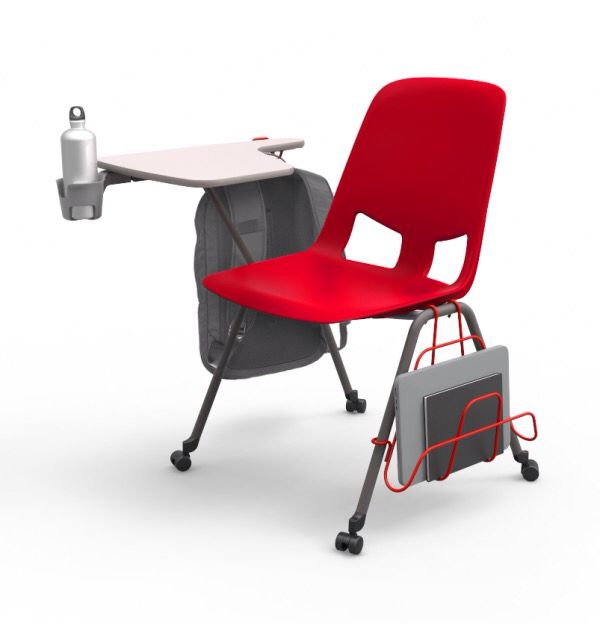 a red chair sitting next to a computer desk