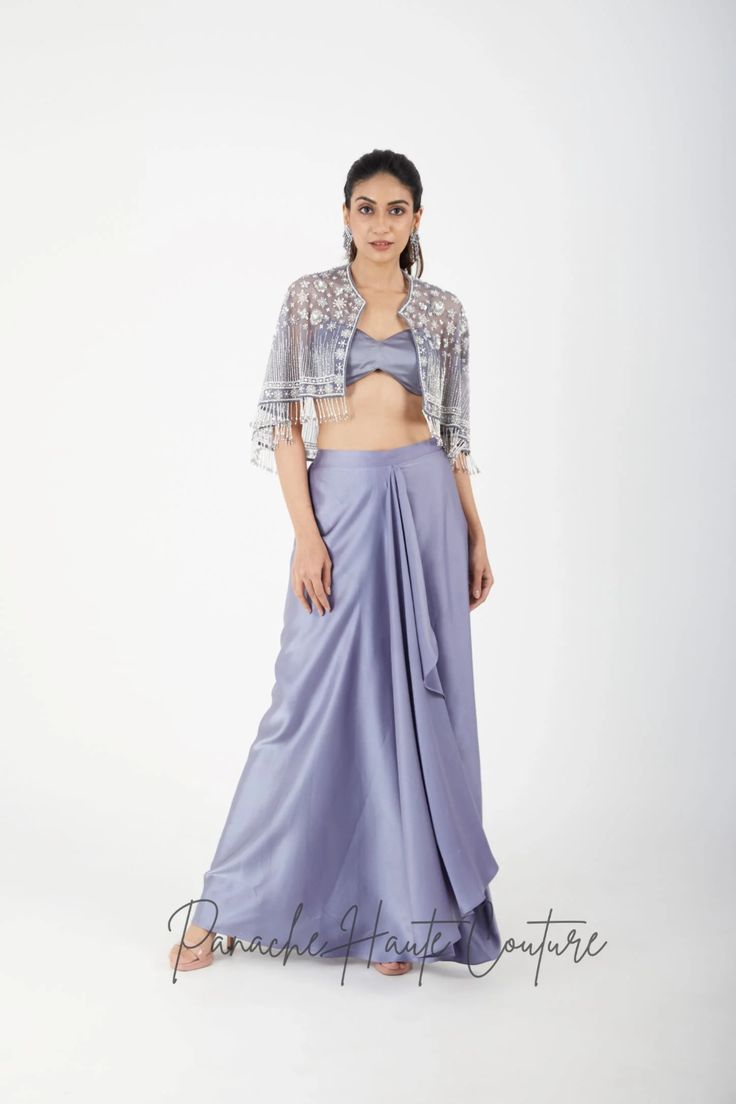 Grey Color Dhoti Skirt with Cape – Panache Haute Couture Festive Occasion Wear Pre-draped Saree, Festive Pre-draped Traditional Saree, Elegant Front Open Georgette Choli, Elegant Silk Palazzo Set With Unstitched Blouse, Front Open Silk Set With Dupatta, Silk Front Open Sets With Dupatta, Festive Silk Pre-draped Saree With Cape Sleeves, Traditional Pre-draped Saree For Occasion Wear, Silk Draped Sets For Diwali