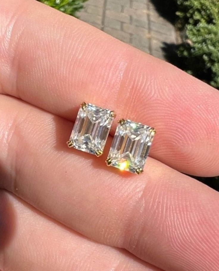 Moissanite Emerald Cut Earrings // 14K Gold Diamond Stud Earrings // April Birthstone Bridal Earrings // wedding gift for her Item Details * Made to Order. * Stone Type: Moissanite / Simulated Diamond * Stone Shape: Emerald cut  * Gold : 925/ 10K/ 14K/ 18K Solid Gold * Custom Gold Color: Rose Gold, Yellow Gold, White Gold * Stone size : 9.00 x 7.00 MM * Stone Total CTW: 4.00 ctw * Diamond Color Clarity: VVS/ White  RocksjewelleryUS is one of the biggest manufacturers of loose moissanite as well as a moissanite engagement ring, wedding ring, vintage engagement ring, wedding Bands and ring sets, anniversary rings, wedding ring sets, bridal sets, antique vintage rings, classic rings, art-deco ring. Engraving: ♦ Personalize your jewelry with our engraving service, available for an additional f Formal Moissanite Baguette Cut Earrings, Sterling Silver Baguette Cut Earrings Gift, Baguette Cut Earrings For Wedding, Fine Jewelry, White Baguette Cut Earrings For Wedding, Emerald Cut Diamond Earrings With Prong Setting Gift, Moissanite Baguette Cut Earrings For Gift, Dazzling Baguette Cut Diamond White Earrings, Moissanite Baguette Cut Earrings As A Gift, Dazzling Diamond White Baguette Cut Earrings