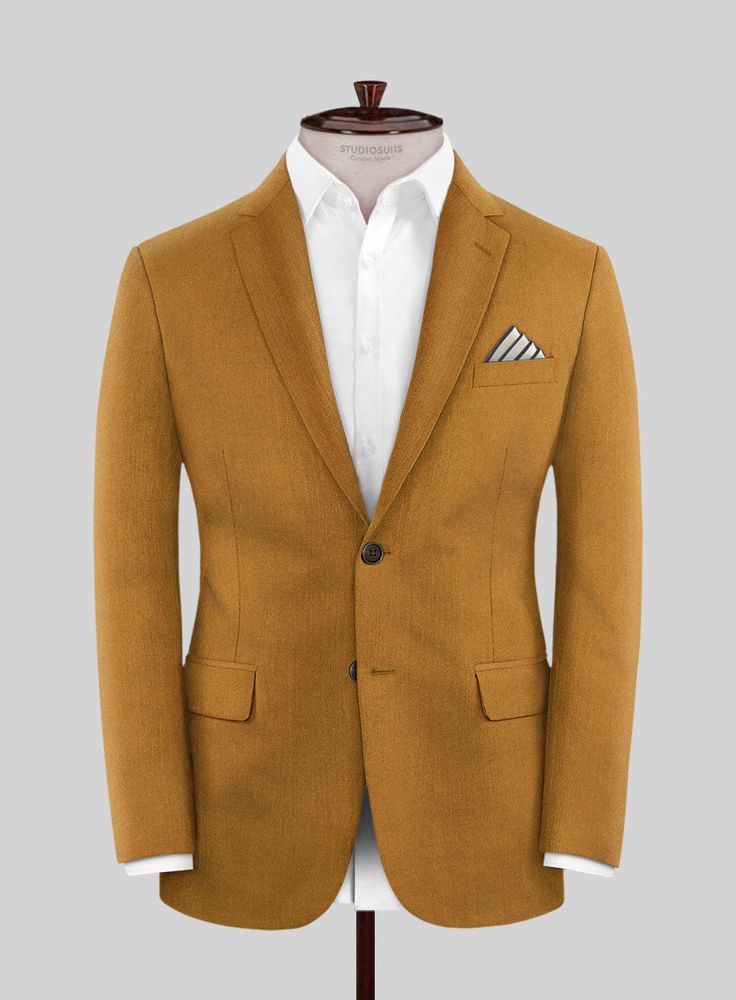 Become the center of attention when you slip into our Italian Turna Mustard Flannel Jacket. Expertly crafted from Super 120's pure wool fabric, this jacket boasts a polished finish that gracefully conforms to your body, providing exceptional comfort. Its vibrant, sun-kissed mustard color exudes luxury and warmth, making it an essential addition to your winter wardrobe. This jacket offers a sophisticated and formal option, enhancing your winter fashion with extra charm. Step out confidently and l Brown Linen Suits For Business Casual, Elegant Orange Blazer With Notch Lapel, Elegant Single Breasted Orange Blazer, Brown Linen Business Suits, Elegant Orange Notch Lapel Suits, Tailored Brown Linen Blazer, Elegant Tailored Orange Suit, Elegant Tailored Orange Blazer, Elegant Fitted Orange Suit