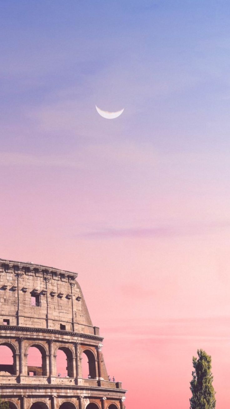 an image of the moon in the sky over the colossion at sunset or dawn