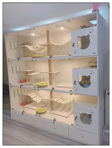 a room filled with lots of white shelves next to a wall covered in stuffed animals