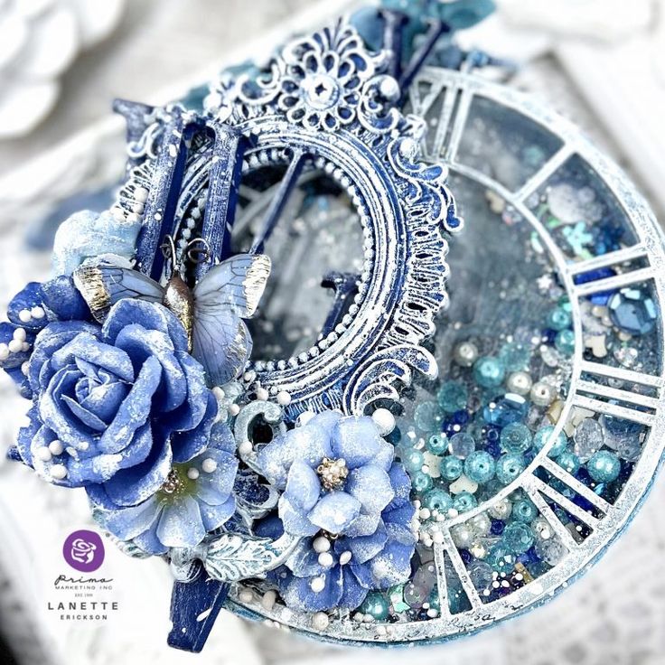 an altered clock with blue flowers on it