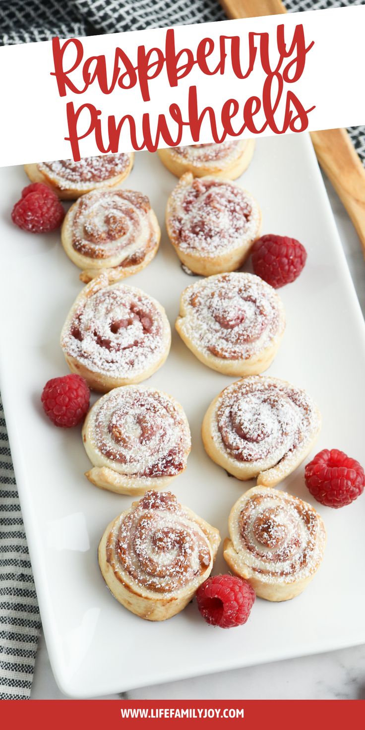 raspberry pinwheels with powdered sugar and fresh raspberries on top