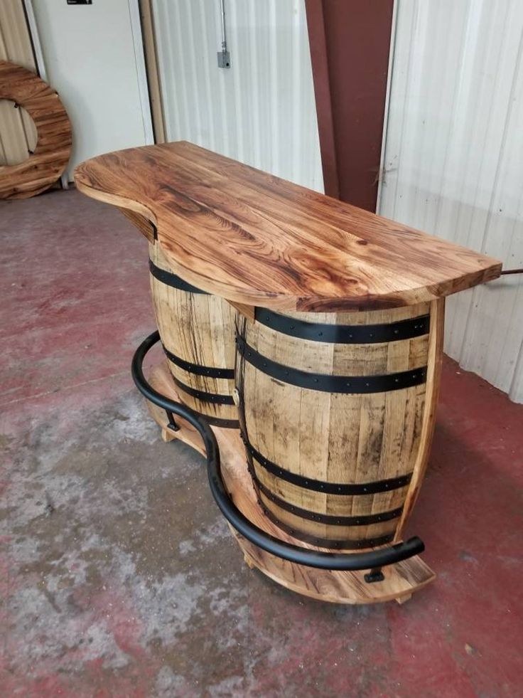 two wooden barrels sitting on top of each other