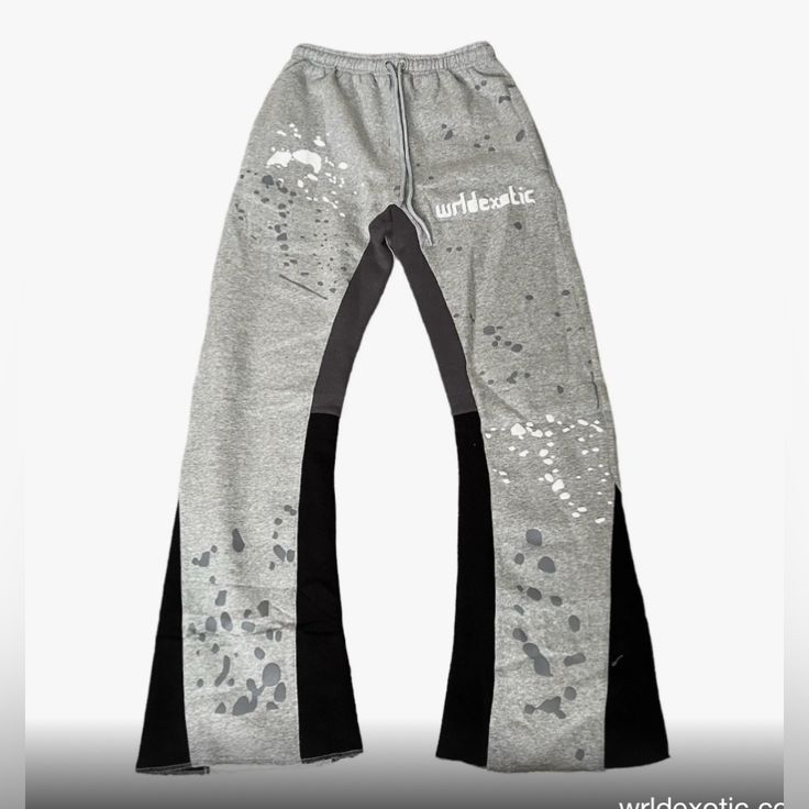 Size S Never Worn Grey And Black Splatter Flare Sweatpants. No Material Tag So Unsure Of Material But Outside Is Standard Sweatpant Material And Lining Is A Fleecy Material. Edgy Gray Bottoms For Streetwear, Gray Ripped Bottoms For Streetwear, Ripped Gray Bottoms For Streetwear, Urban Style Ripped Gray Bottoms, Gray Distressed Grunge Bottoms, Fitted Gray Grunge Bottoms, Flare Sweat Pants, Flare Sweatpants, Designer Loungewear