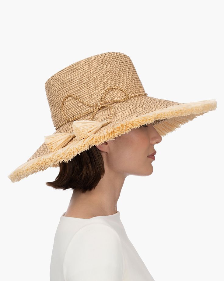 If you are looking for a woman's sun hat for sale online that is sure to turn heads, look no further! Named from the Caribbean Island that has endless beaches and warm turquoise water, this sun hat made of Squishee®, is a show stopper. This flirty, tropical sun hat combines the pinched crown of a fedora with a wide brim, edged all around with glamorous straw fringe. Wherever you adventure, from St. Barths to Antibes, approving smiles are sure to follow! Squishee® straw is a sustainable man-made Wide Brim Sun Hat With Upf 50+ For Pool, Wide Brim Hats For Pool, Wide Brim Panama Hat With Upf 50+ For Pool, Upf 50+ Coastal Hat For Sunbathing, Upf 50+ Brimmed Panama Hat For Pool, Coastal Hat With Upf 50+ For Sunbathing, Lightweight Short Brim Hat For The Pool, Lightweight Short Brim Hat For Pool, Lightweight Short Brim Pool Hat