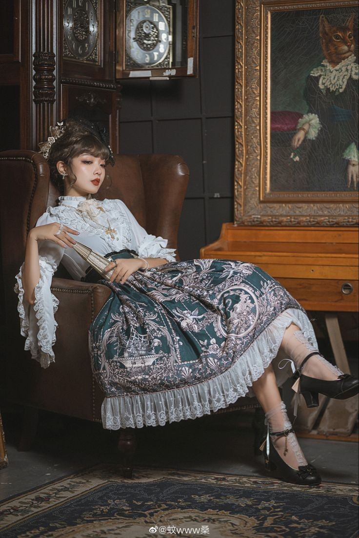 a woman sitting in a chair with a book on her lap and an antique clock behind her