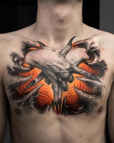 a man with tattoos on his chest has an orange and black design in the middle