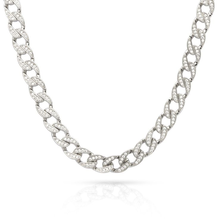 Men's Iced Cuban Link Chain has been expertly designed and crafted to achieve the ideal length, weight, and shine, all while providing a comfortable fit for everyday wear. This chain stands out with its sleek design and unique touch, featuring white cubic zirconia stones. Be unique, be modern, be cool with this essential piece in your collection. Cubic Zirconia Chain Necklace, Luxury Diamond Oval Link Chain Necklace, Classic Cubic Zirconia Chain Necklaces, Luxury Oval Link Diamond Chain Necklace, Classic Cubic Zirconia Chain Necklace, Cuban Link Necklace In Diamond White With Cubic Zirconia, Luxury Diamond Chain Necklace With Oval Links, Elegant Cuban Link Necklace In Cubic Zirconia, Formal Diamond Chain Necklace With Silver Chain