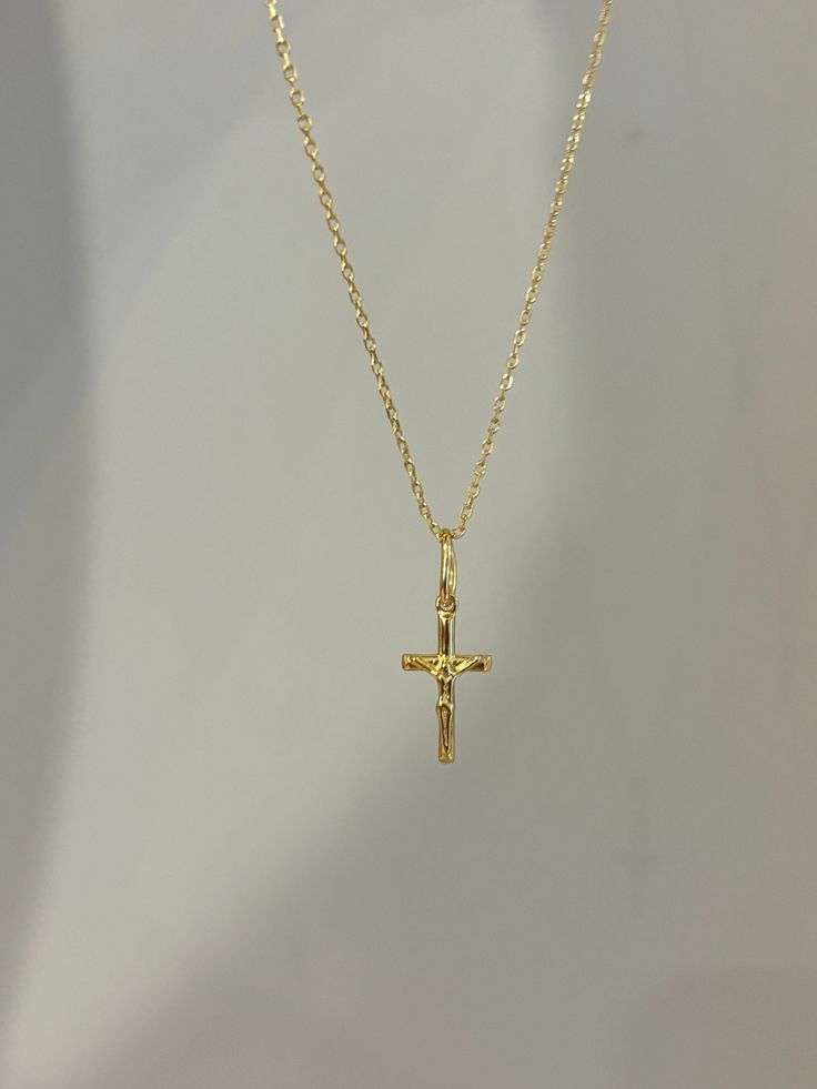 Our cross necklace is a classic, simple and elegant - perfect for everyday wear! Information: ✨ Sterling Silver (925 stamped) | 14K Gold Plated ✨ Adjustable length: 16" - 18" ✨ Hypoallergenic ✨ Tarnish resistant ✨ Water friendly Our cross necklace is highly polished, featuring an splendid level of craftsmanship and attention to detail. On the charm, you can see the image of Jesus on the cross. The charm is dainty and comfortable to wear. Plus, the necklace is adjustable. You have the ability to Cute Cross Necklace Gold, Minimalist Cross Pendant Necklaces For Baptism, Minimalist Cross Pendant Necklace For Baptism, Minimalist Cross Pendant Necklace For First Communion, Dainty Cross Pendant Necklace For Baptism, Dainty Cross Necklace For Baptism, Elegant Cross Necklace For Confirmation, Classic Everyday Cross Pendant Necklace, Everyday Classic Cross Pendant Necklace