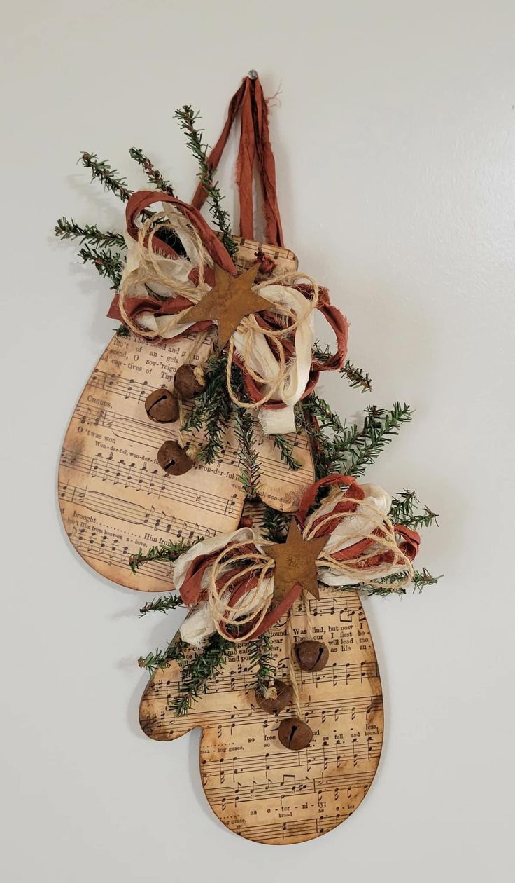 a pair of wooden shoes hanging on a wall with sheet music notes attached to it