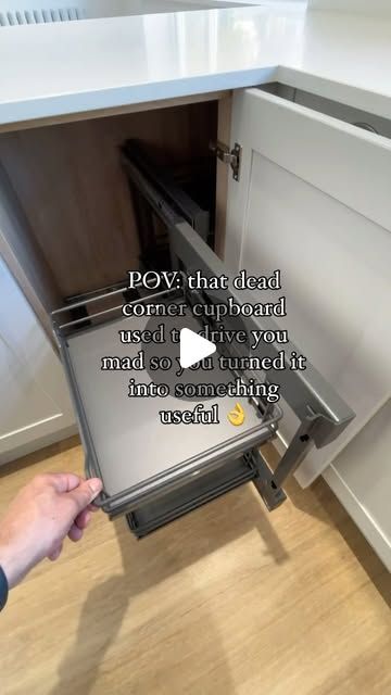 someone is opening the door to their kitchen cabinet with an ad on it that reads, pov that dead corner cupboard used to give you mad so turned it into something interesting