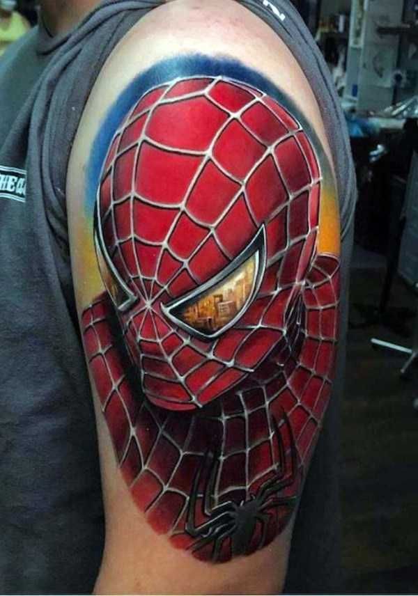 a man with a spiderman tattoo on his arm and shoulder, in the shape of a