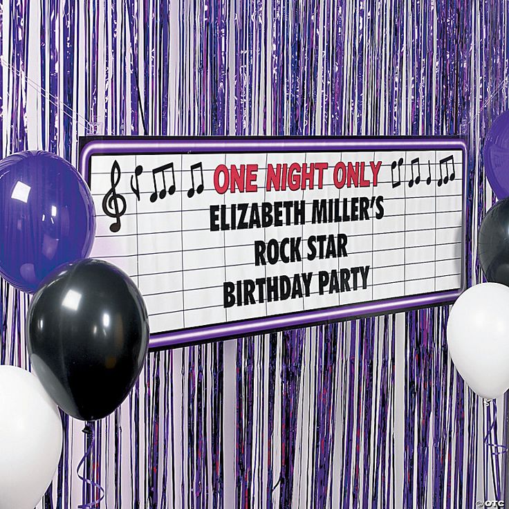 one night only sign with balloons and streamers in front of purple curtained backdrop