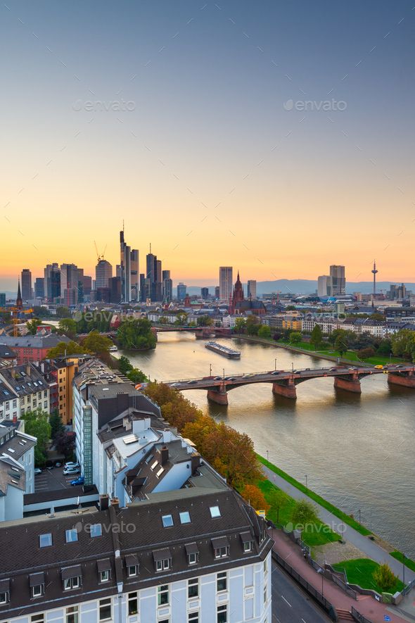 an aerial view of the city and river at sunset - stock photo - images in high resolution