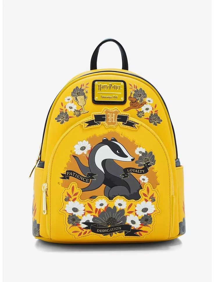 a small yellow backpack with an animal on the front and flowers on the back,