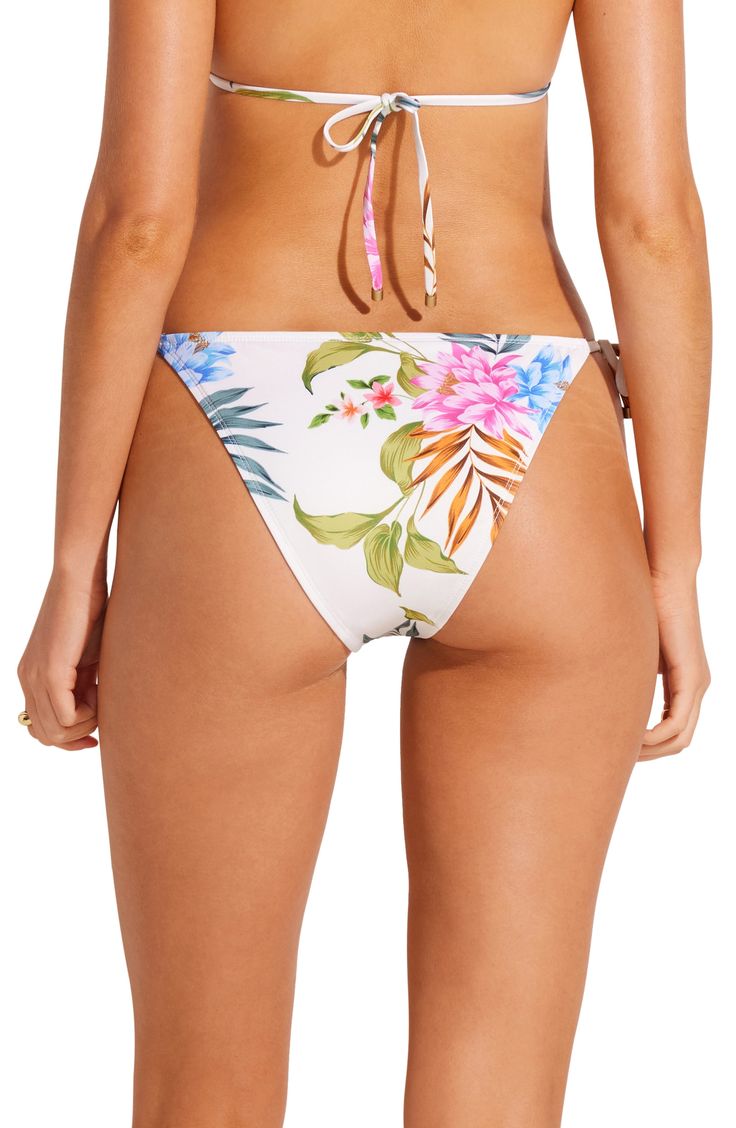 Tropical blooms bring vacation-ready vibes to these cheeky bikini bottoms finished with side ties for a customizable fit. Side ties Cheeky back coverage Lined 84% polyester, 16% Lycra® spandex Hand wash, dry flat Made in the USA Tropical Tie-side Swimming Bottoms, Tropical Print Tie-side Bottoms For Poolside, Tropical Print Tie-side Bottoms For Beach Party, Tropical Tie-side Bottoms For Beach Season, Tropical Tie-side Bottoms For Beach Party, Beachwear Bottoms With Tropical Print And Tie-side, Summer Vacation Bottoms With Side Ties, Tropical Vacation Tie-side Bottoms, Vacation Swim Bottoms With Side Ties