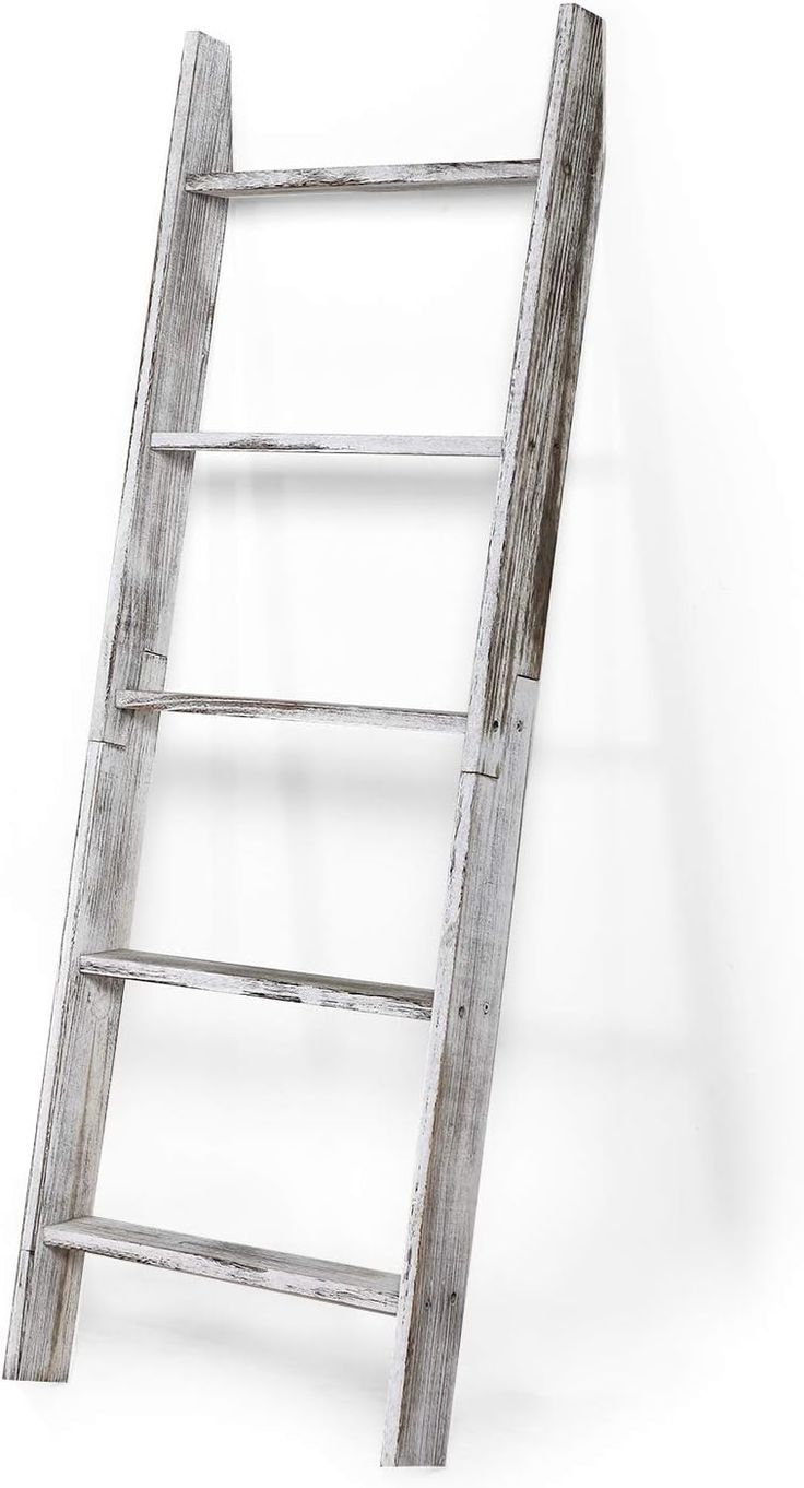 an old wooden ladder leaning against the wall with no one on it's side