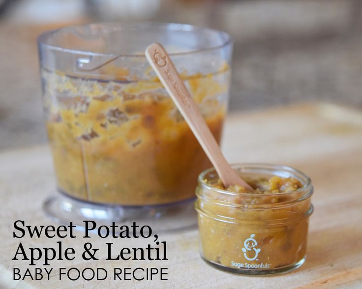 a baby food recipe in a glass jar with a wooden spoon