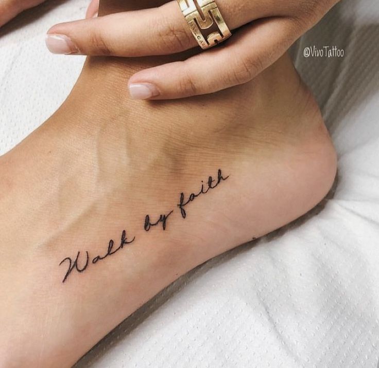 a woman's foot with writing on it that says, wash your feet in cursive ink