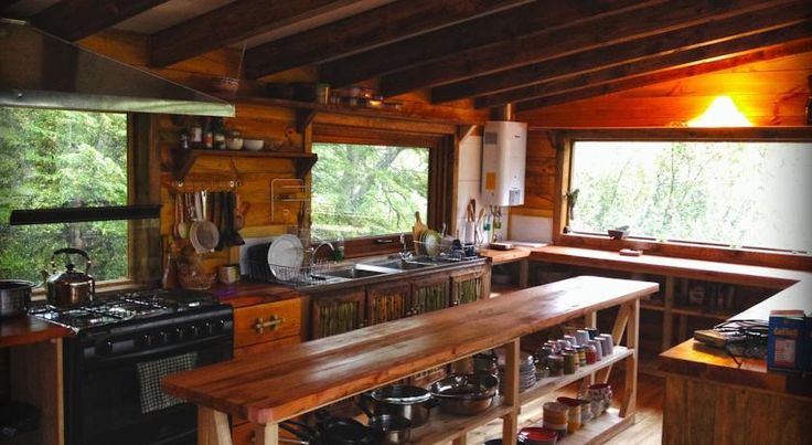 a kitchen with an oven, stove and counter top in it's center area