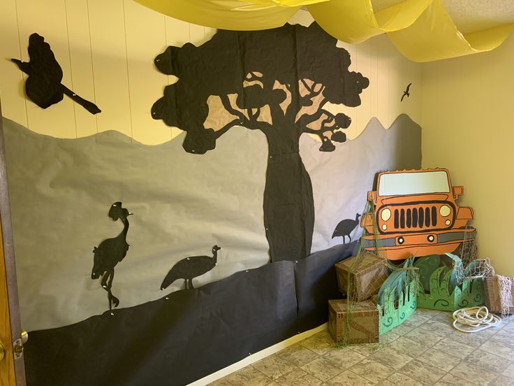 a child's room decorated in black and white with an orange jeep on the floor