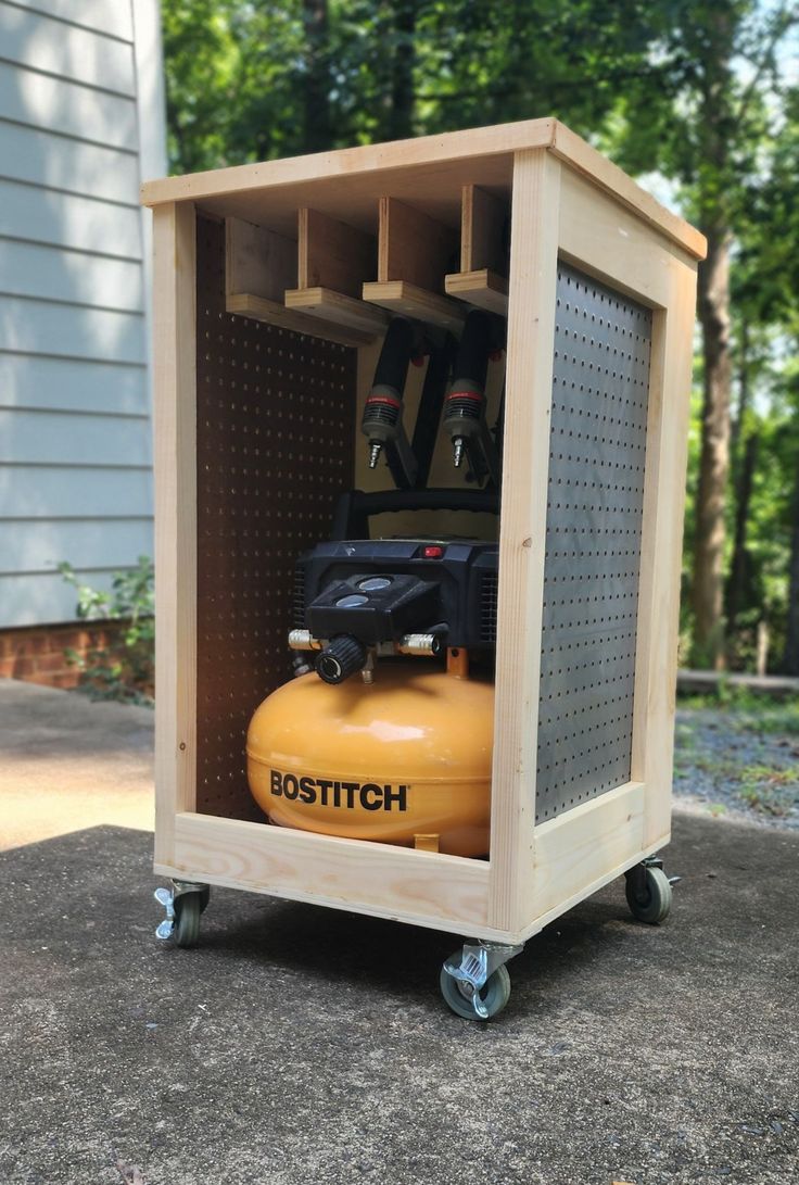 a yellow fire extinguisher sitting on top of a cement floor next to a house