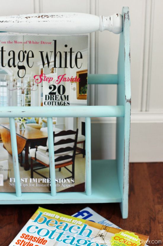 a magazine rack sitting on top of a wooden floor